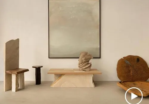 wood, stone, and ceramic collectible objects compose rebirth paris exhibition