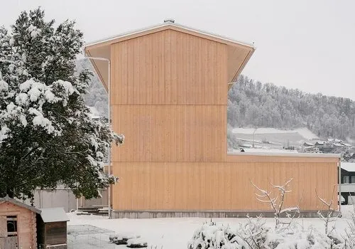 Swiss Precision Meets Vertical Living: A Compact Timber Tower Redefines Urban Infill