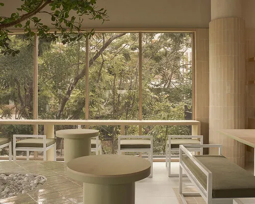 Thai Serenity: A Tranquil Café Where Terracotta, Oak, and Light Converge