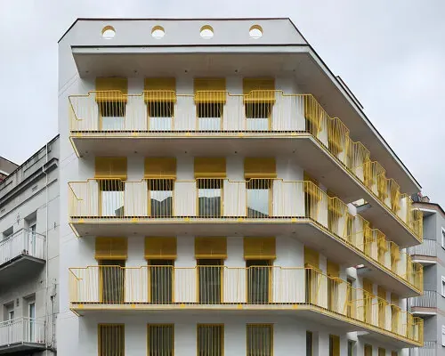 Vibrant Vistas: Spain's Iconic Corner Reborn with Luminous Yellow Balconies